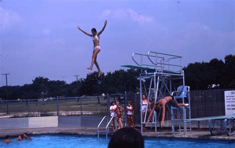 Two Young Women Jumping Off Of Diving Boards Side 1 Of 1 The