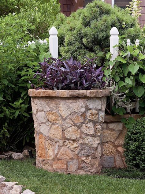 Modern Freestanding Container A Planter In A Faux Lead Finish Is A