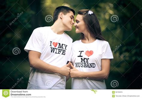 Portrait of lovely asian newlywed couple with copy space on white wall background. Married Couple Wiht Words I Love My Wife And Stock Photo ...