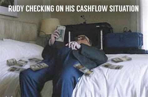 Photo Rudy Giuliani Checking On His Cashflow Situation While Waiting