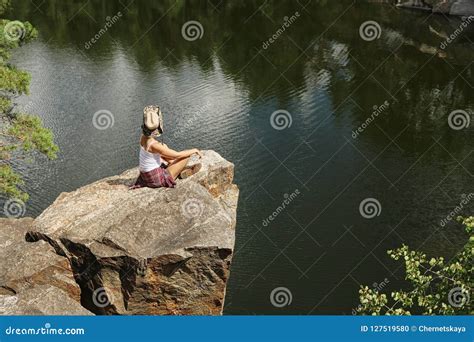 Young Woman On Rocky Mountain Near Lake Stock Photo Image Of Explorer