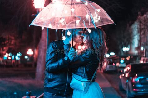 Guy And Girl Kissing Under An Umbrella Stock Image Image Of Magic