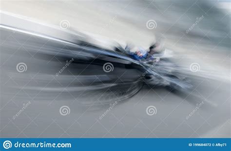 Motion Blur Of Sports Car At Motorsports Championship Race Stock Photo