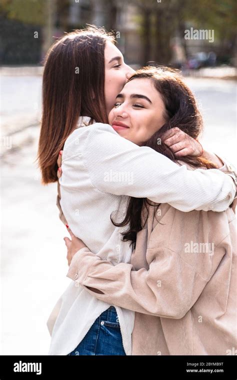 Meeting Of Two Girls Friends With Hug In City Stock Photo Alamy