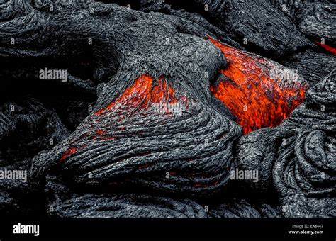 Molten Lava Rock That Glows From Its Extreme Heat Flows From An