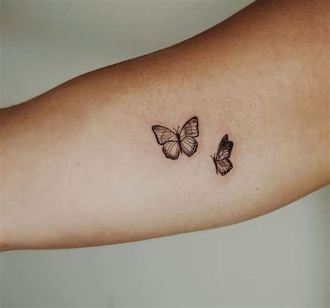 Black Butterflies Tattoo On Arm Black Butterfly Tattoo On Arm