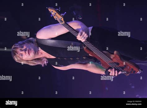 Def Leppard Bassist Rick Savage Is Shown Performing On Stage During A Concert Appearance Stock