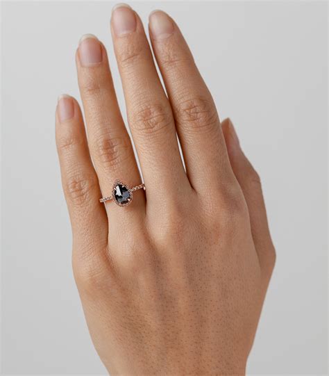 Solitaire engagement rings are comprised of a single center diamond or gemstone mounted in a simple setting. One of a Kind Bridal | Bellini - Black Pear Shaped Diamond ...