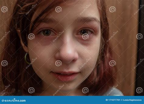 Portrait Of Little Girl Crying With Tears Rolling Down Her Cheeks A