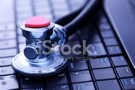 Stethoscope On Laptop Stock Photos