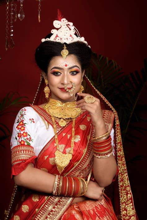 Stunning Indian Bride Dressed In Hindu Red Traditional Wedding Clothes Sari Embroidered With
