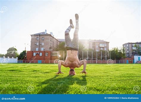 Man Standing On His Head Upside Down Strong Muscular Inflated Extreme