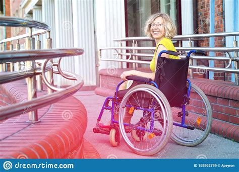 Woman On Wheelchair Entering The Platform Stock Image Image Of