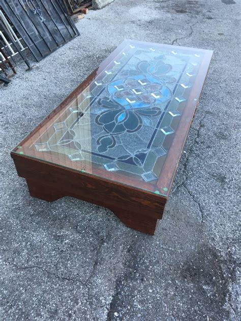 This contemporary coffee table has been designed with a glass tabletop and a floating shelf, finished with a black ash wood veneer. Vintage Stained Glass Coffee Table 14x32x70 - Sarasota ...