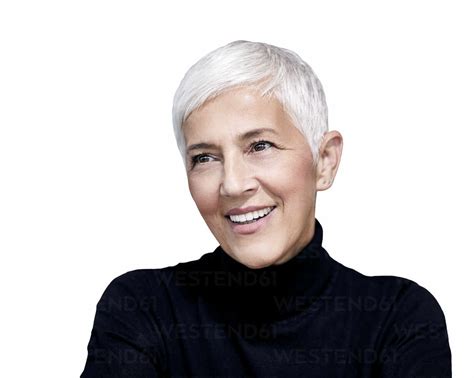 Portrait Of Mature Woman With Short Grey Hair Wearing Black Turtleneck Pullover Against White