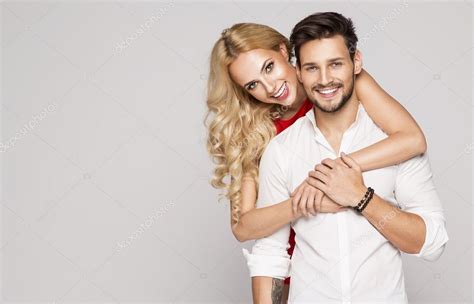 Portrait Of Smiling Beautiful Couple Stock Photo By ©kiuikson 97249646