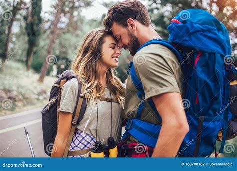 Couple Hiking On The Path In Mountains Stock Photo Image Of Forest