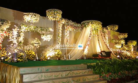 A beautiful centre stage decoration shows off the essence of your wedding to the best. hydrabad event wedding and reception flowers decoration ...