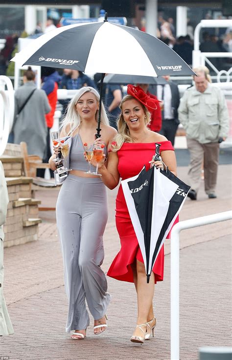 Chester Races Punters Brave Showers In Racy Outfits Daily Mail Online