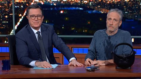 watch the late show with stephen colbert jon stewart climbs out from under colbert s desk to