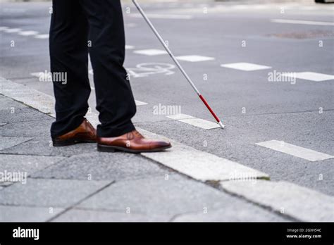 Blind Man Walking With Cane Stick On Road Stock Photo Alamy