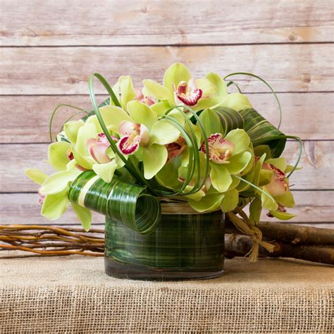 The roundness of these flowers. CYMBIDIUM ORCHID ARRANGEMENT in New York, NY | Flowers by ...