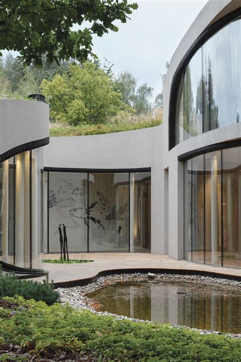Niko Architect Weaves Organic Futuristic House Into Artificial