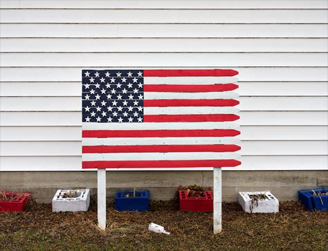 American Flag Painted On A Piece Of Wooden Stockage Fence In Andrews