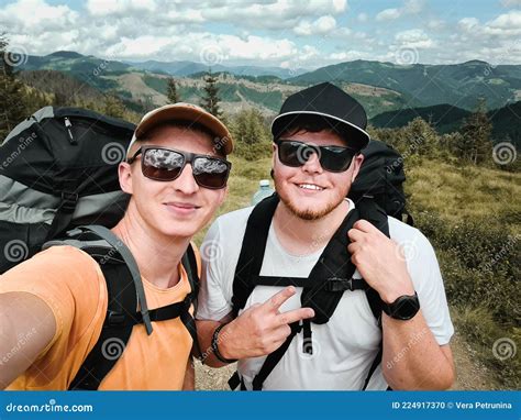 Two Friends Hikers Taking Selfie At Mountains Peak Stock Photo Image