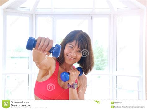 Mature Woman Working Out With Dumbbells Stock Photo Image Of Mature Person