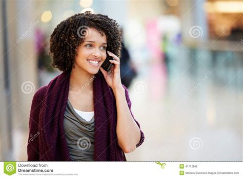 Woman In Shopping Mall Using Mobile Phone Stock Photo Image Of Happy
