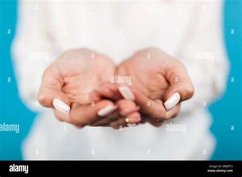 Female Hands On Blue Background Stock Photo Alamy