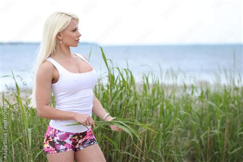 Girl In A White T Shirt With Big Breasts Stock Photo Adobe Stock