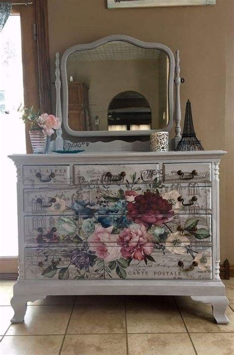 An Old Dresser With Flowers Painted On It