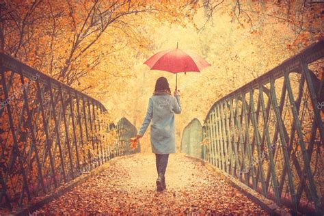Girl With Umbrella In Autumn Park — Stock Photo © Massonforstock 128318752