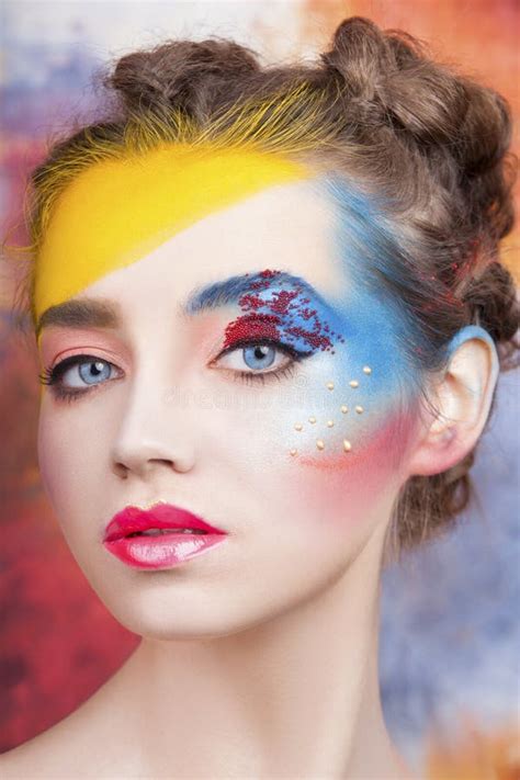 Portrait Of Beautiful Young Woman With Paint On Face Stock Image