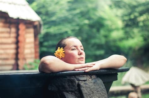 Premium Photo Woman Enjoying Spa In Hot Tubs Outdoors