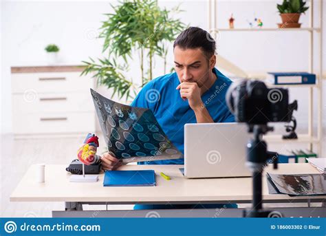 Young Male Doctor Recording Video For His Blog Stock Photo Image Of