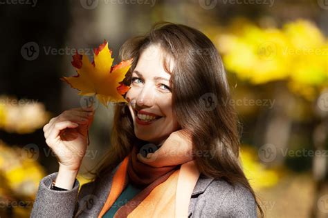 Young Woman Holding Maple Leaves In Her Hand Near Her Face 3706948