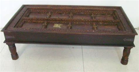 Old doors can find new purpose as interior doors, freestanding room dividers or even as rebuilt furniture and shelving. Coffee table top made from an antique door