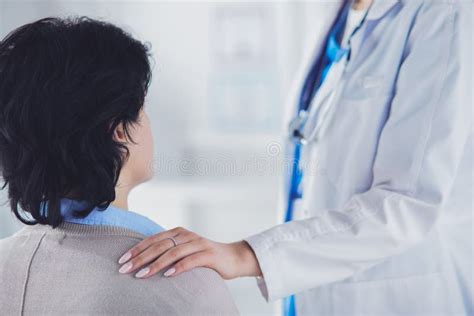 Female Doctor Giving A Consultation To A Patient And Explaining Medical