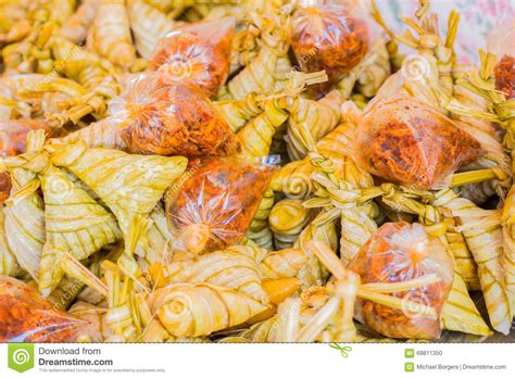 They make everything into such a big deal. Pile Of Triangle Shaped Rice In Banana Leafs Stock Photo ...