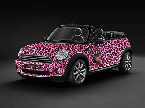 A Pink And Black Car With Leopard Print