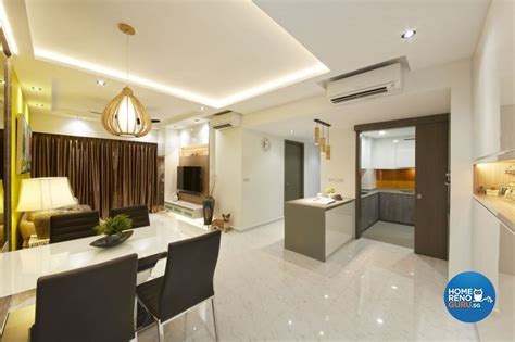 An Open Concept Living And Dining Room With White Marble Flooring Gold