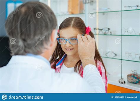 Pleasant Cute Girl Trying On New Glasses Stock Image Image Of Ophthalmology Helping 156650389