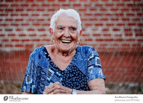 Portrait Of Old Lady In Her 80s Laughing Happily A Royalty Free Stock