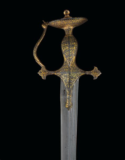 An Elegant Calligraphic Gold Damascened Sword Tulwar Hilt Central