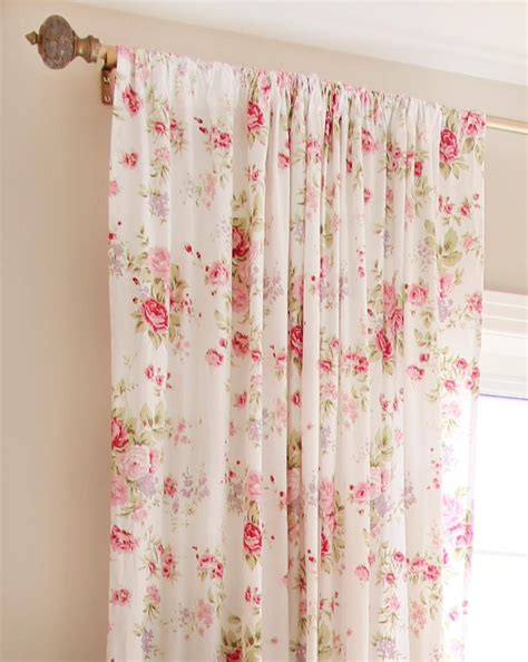 The Curtains In This Room Are Pink And White With Flowers On Them