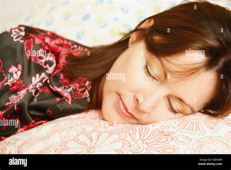 Close Up Of A Mature Woman Sleeping On The Bed Stock Photo Alamy