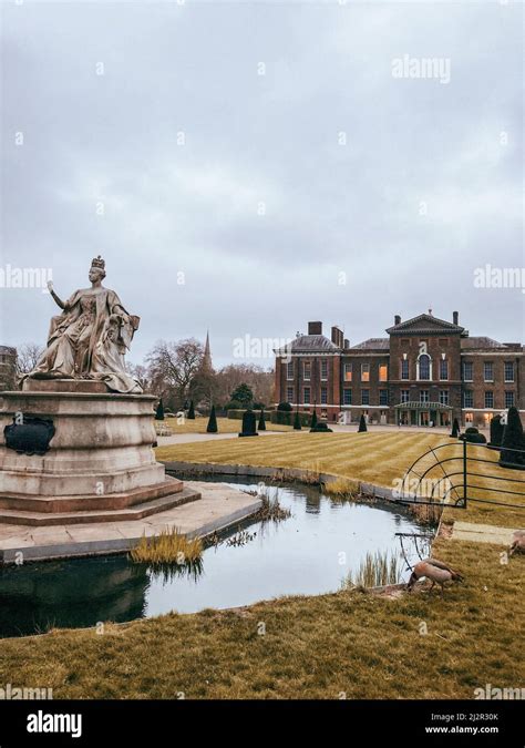 Statue Of Queen Victoria In Front Of Kensington Palace On A Cloudy Day
